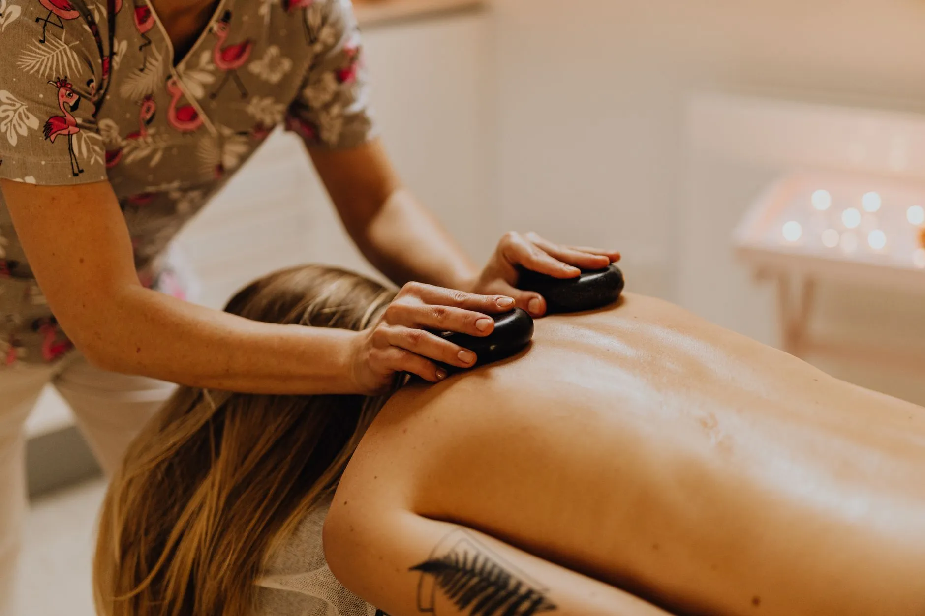 Hot stones laid along a client's back during a massage