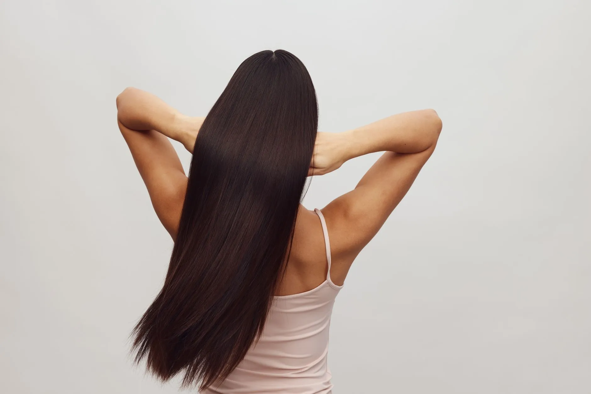 Long, straight, glossy dark hair seen from behind